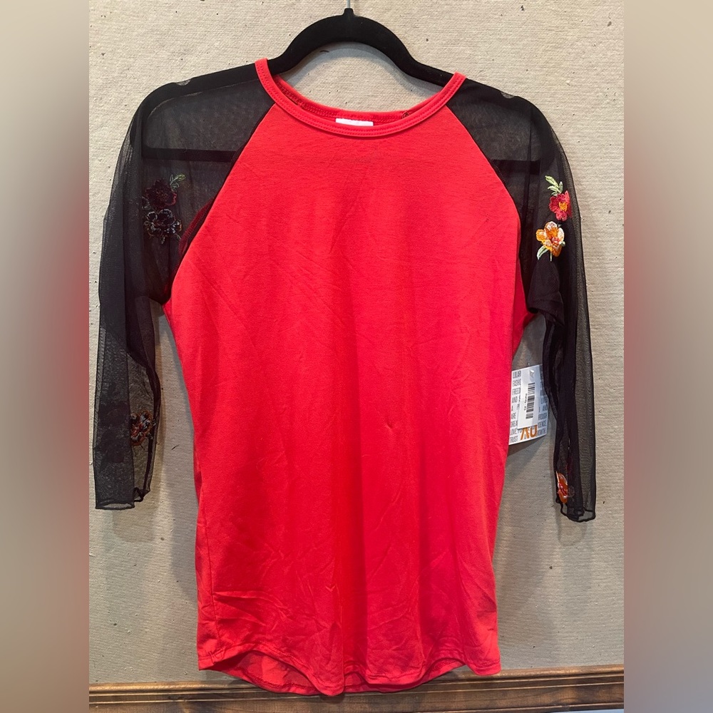 Red shirt with sheer sleeves